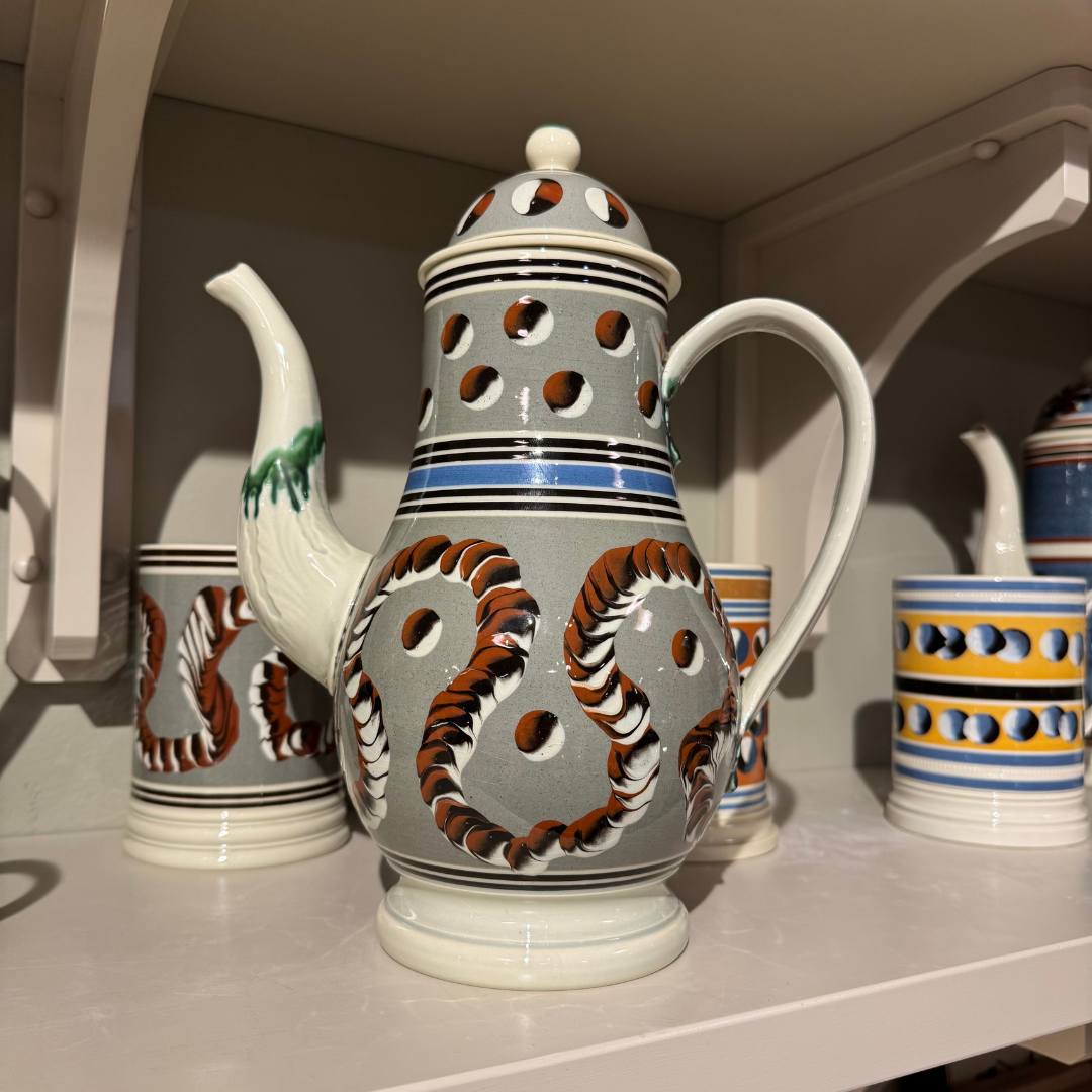 Vintage Mochaware Coffee Pot with a Green Ground and Variegated Wave Pattern.