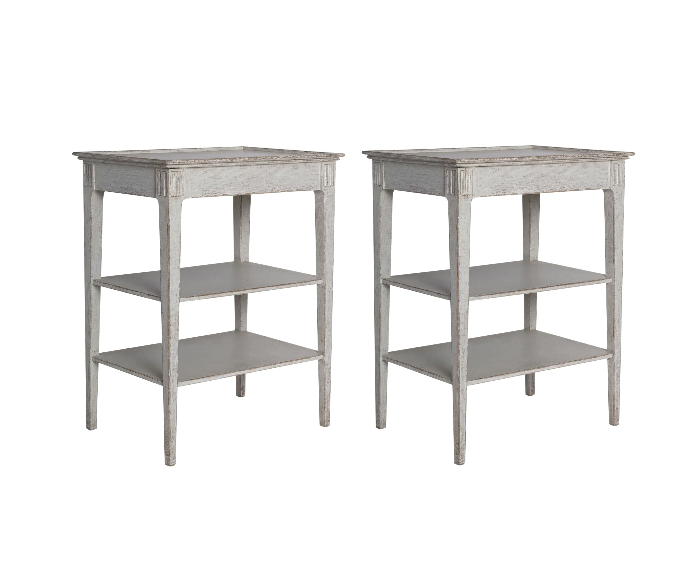 A Pair of Three Tier Side Tables in an Antique White Finish | Newport Lamp And Shade | Located in Newport, RI
