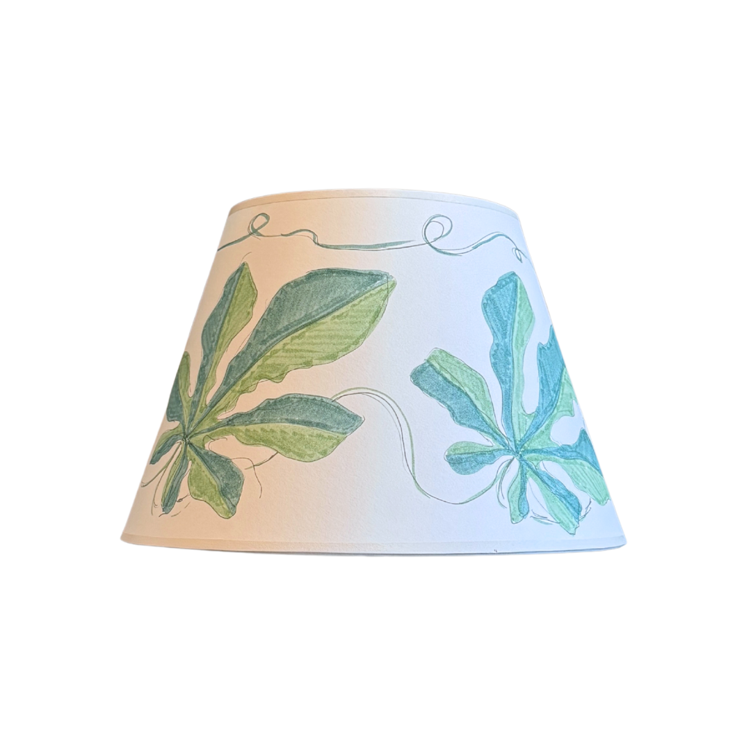 Lampshade with leaf patterns on a white background