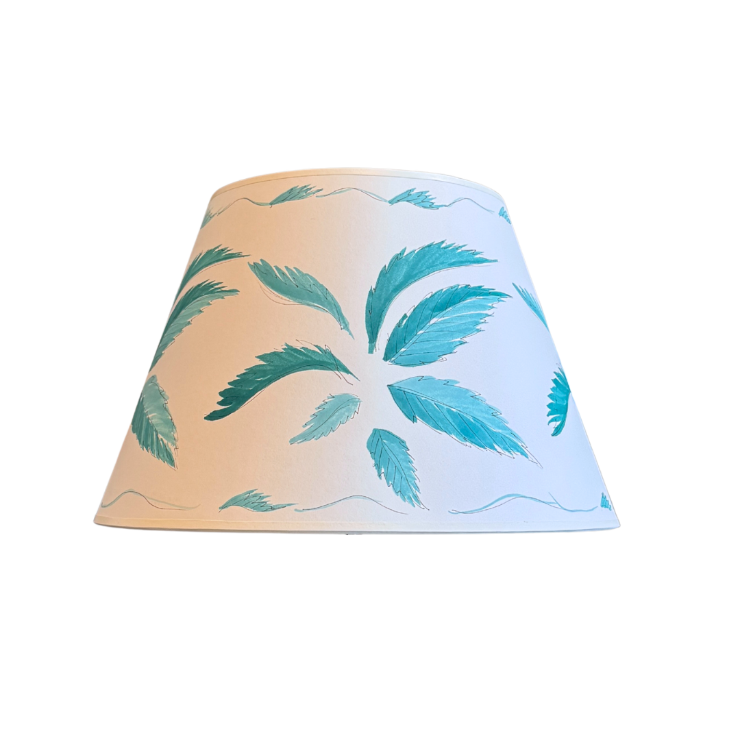 Lampshade with palm leaf pattern on a white background
