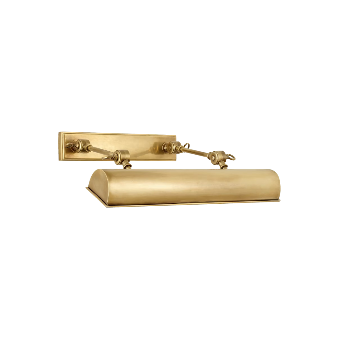 Gold wall-mounted light fixture on a white background
