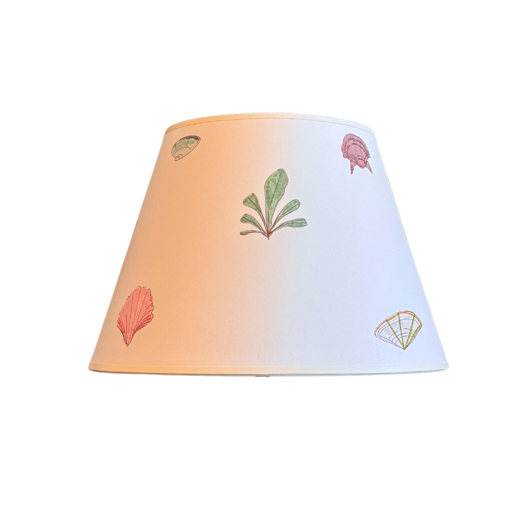 Gradient lampshade with floral patterns on a white background